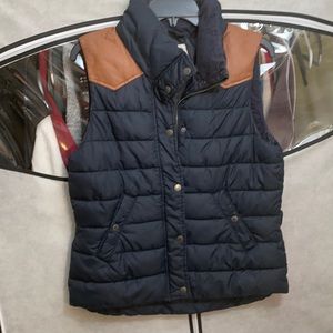 H&M equestrian navy puffer vest with suede brown detail